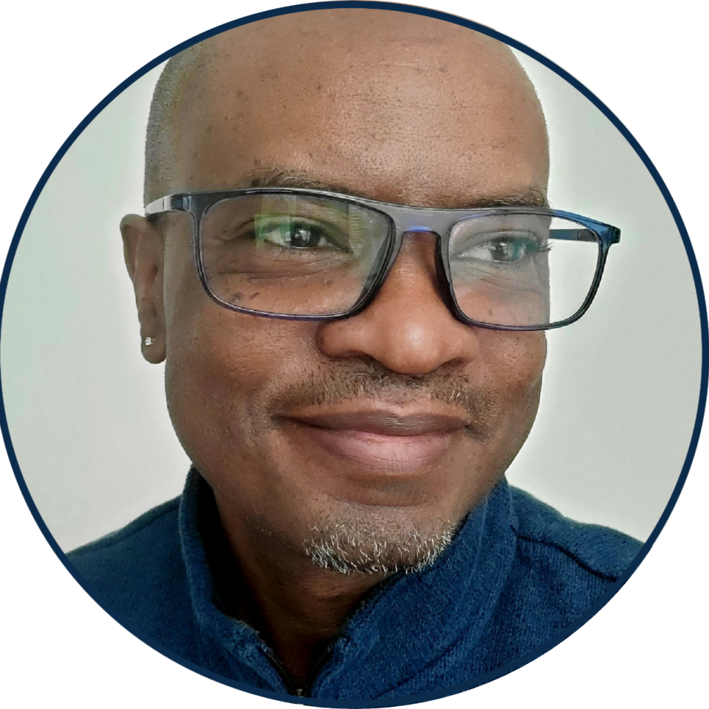 Photo of Cedric Brown smiling and looking off camera